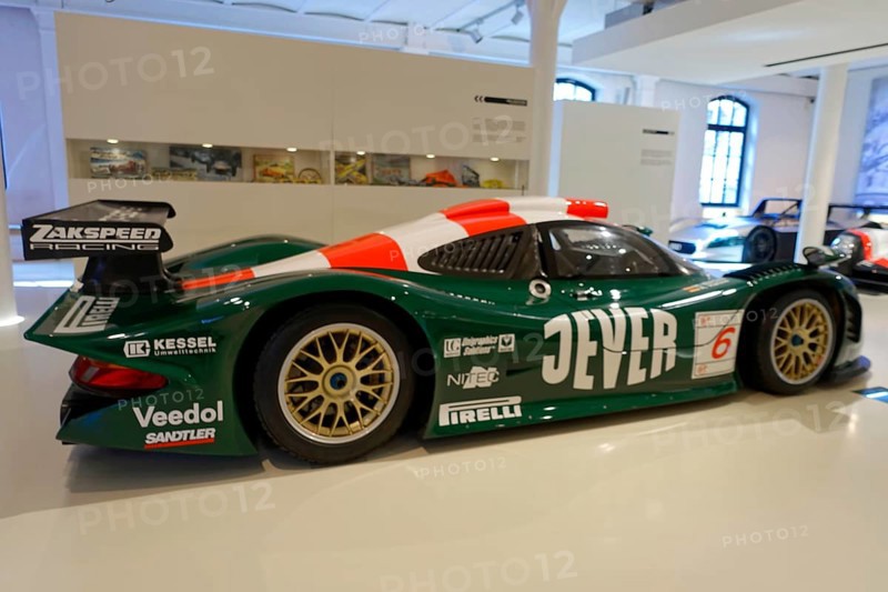 A green and black painted Zakspeed racing car with sponsor logos in the museum, AUTOMUSEUM PROTOTYP, Hamburg, Hanseatic City of Hamburg, Germany Europe