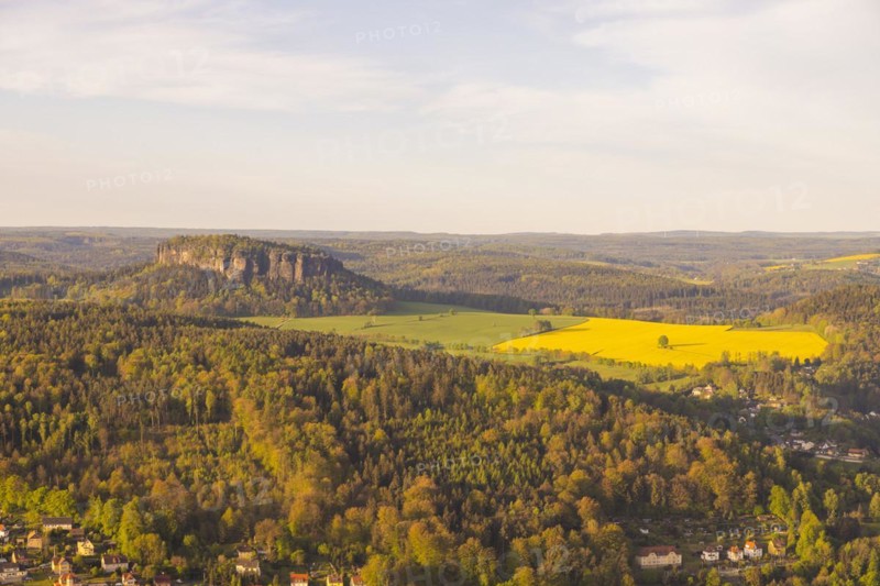 Sunrise on the Lilienstein. The Lilienstein is the most striking and best-known rock in the Elbe Sandstone Mountains. The Pfaffenstein in the morning light, Ebenheit, Saxony, Germany, Europe