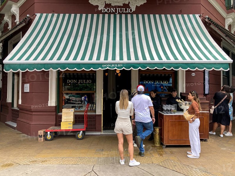 Tourists in front of Don Julio, the most famous steakhouse in Buenos Aires, Argentina, South America