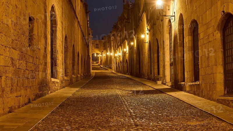 Knights Street, An empty, stone street at night, flanked by historic buildings, night shot, Rhodes Old Town, Rhodes, Dodecanese, Greek Islands, Greece, Europe