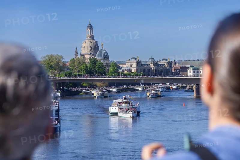 Every year on 1 May, the historic passenger steamers (PD) and the two saloon ships of the White Fleet form a decorated parade with live music on the ships. The banks and bridges of the Elbe are lined with thousands of spectators, Dresden, Saxony, Germany, Europe