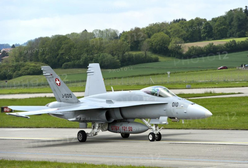 McDonnell Douglas FA 18C Hornet fighter aircraft of the Swiss Air Force taxied at Payerne military airfield, Payerne, Vaud, Switzerland, Europe