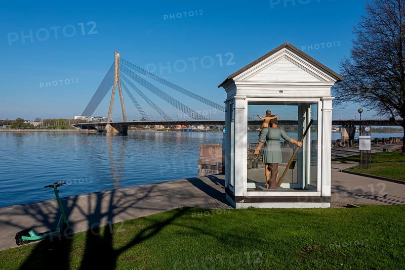 Monument to St Christopher the Great, patron saint of Riga, with the Daugava River and Vansu Bridge behind it, Riga, Latvia, Europe