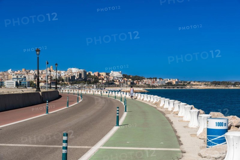 Moll de Llevant waterfront promenade, a 4.5 km long promenade for joggers, walkers, cyclists and skaters at the harbour of Tarragona, Spain, Europe