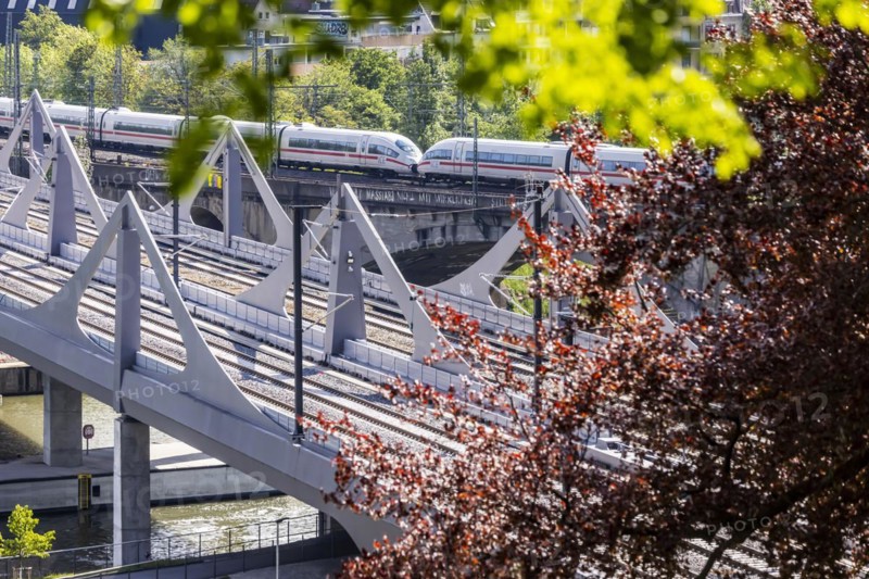 Neckar Bridge, a Stuttgart 21 project. The railway bridge crosses the Neckar in Bad Cannstatt. The bridge is not yet in operation. Traffic rolls over the Rosenstein Bridge behind it, ICE train of Deutsche Bahn AG, Stuttgart, Baden-Wuerttemberg, Germany, Europe