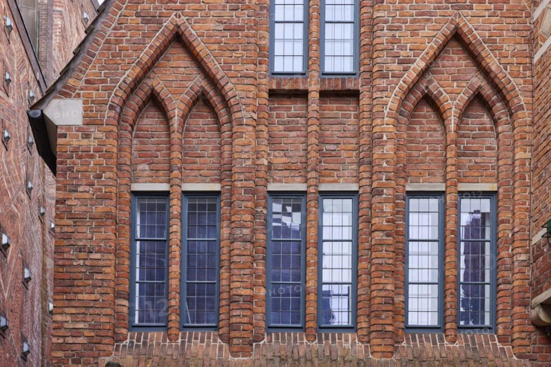 Windows and arched decorations on a brick house in Boettcherstrasse in Bremen, Hanseatic city, state of Bremen, Germany, Europe