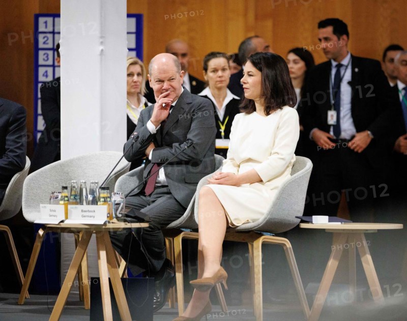 (L-R) Olaf Scholz, Federal Chancellor, and Annalena Baerbock, Federal Foreign Minister, in conversation at the Petersberg Climate Dialogue 2024 in Berlin, 26.04.2024. Photographed on behalf of the Federal Foreign Office'