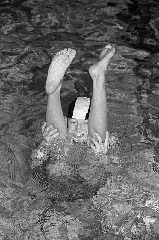 Boy looking through legs of another boy doing handstand, indoor swimming pool, Bamberg, Upper Franconia, Bavaria, Germany, 26 October 1987, vintage, retro, old, historic, funny, Europe