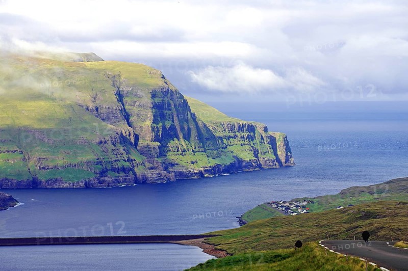 View over high mountains, cliffs and a mountain road, Eidi, Tjornuvik, Faroe Islands, Denmark, Europe