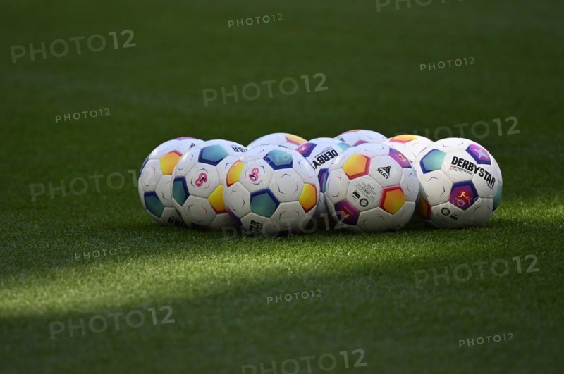 Adidas Derbystar match balls lie on grass, Allianz Arena, Munich, Bavaria, Germany, Europe