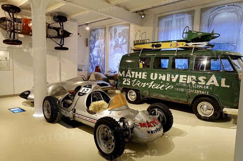 Classic racer next to a Volkswagen bus with advertising in a car museum, AUTOMUSEUM PROTOTYP, Hamburg, Hanseatic City of Hamburg, Germany Europe