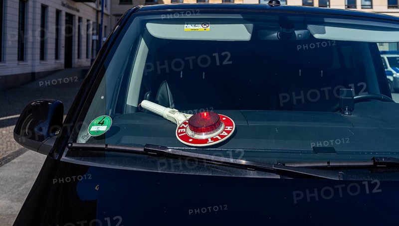 Parked police vehicle with red stop stick behind the windscreen, Berlin, Germany, Europe