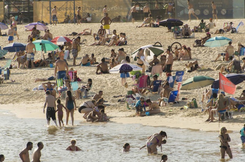 Montevideo, Uruguay, 11th January 2022, Beautiful sunset on Pocitos beach with bathers on a summer day in Montevideo Uruguay, South America