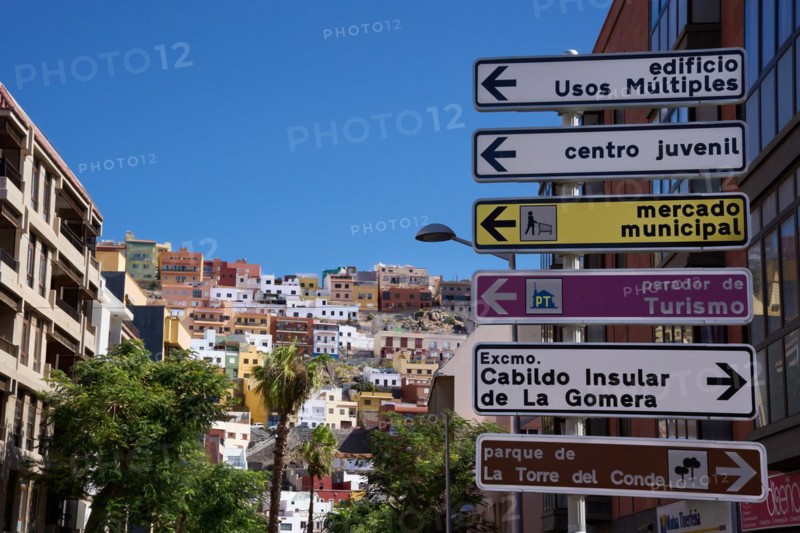 Signposts on a alleyway in the city centre of San Sebastian de la Gomera, behind the alleyway district on the hillside, La Gomera, Canary Islands, Spain, Europe