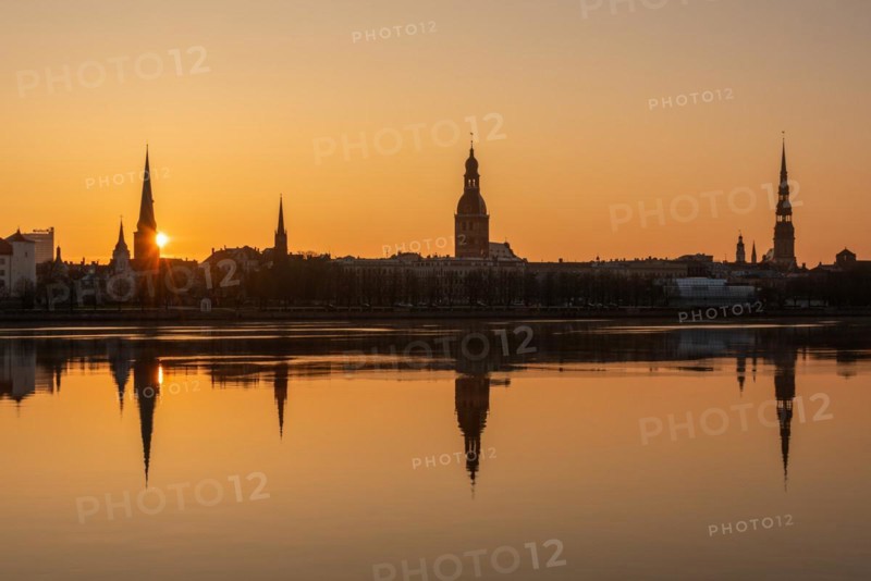 Sunrise in Riga with a view over the Daugava River, St James Cathedral, Riga Cathedral, St Peter's Church, Riga, Latvia, Europe