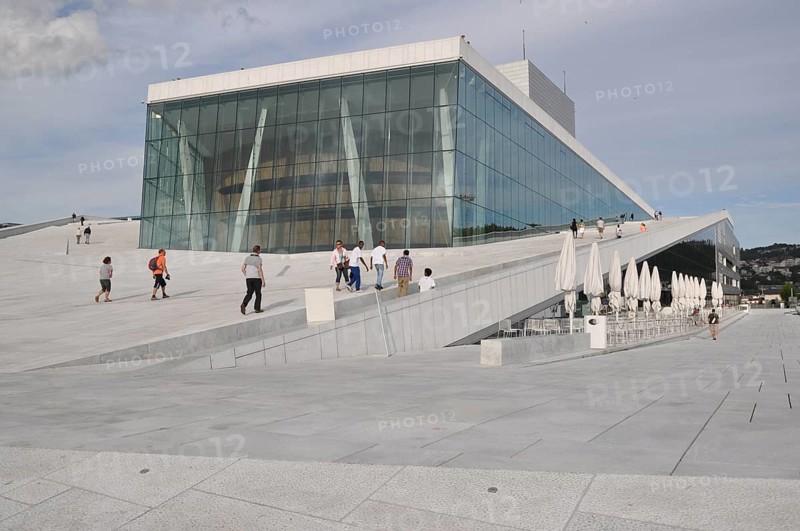 A futuristic building with people walking on the roof, wide glass front, new opera house, Oslo, Norway, Europe