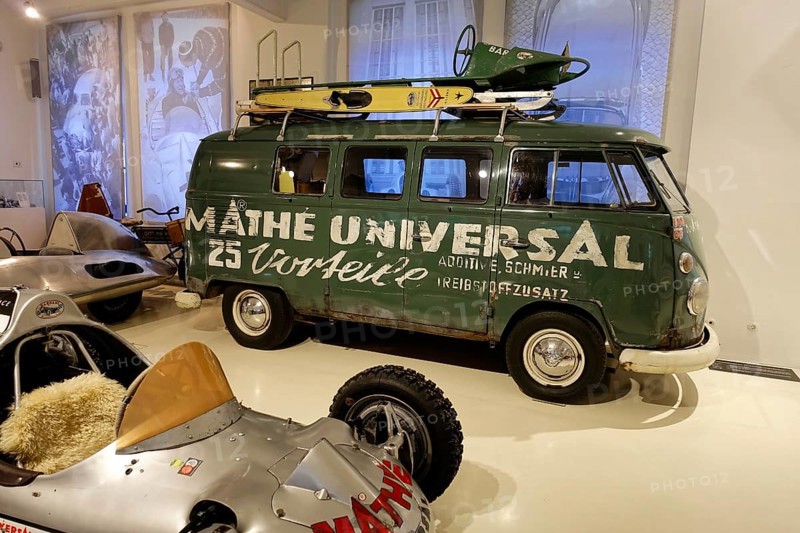 VW Transporter T1, Green Volkswagen bus with roof rack and surfboard in a car museum, AUTOMUSEUM PROTOTYP, Hamburg, Hanseatic City of Hamburg, Germany Europe