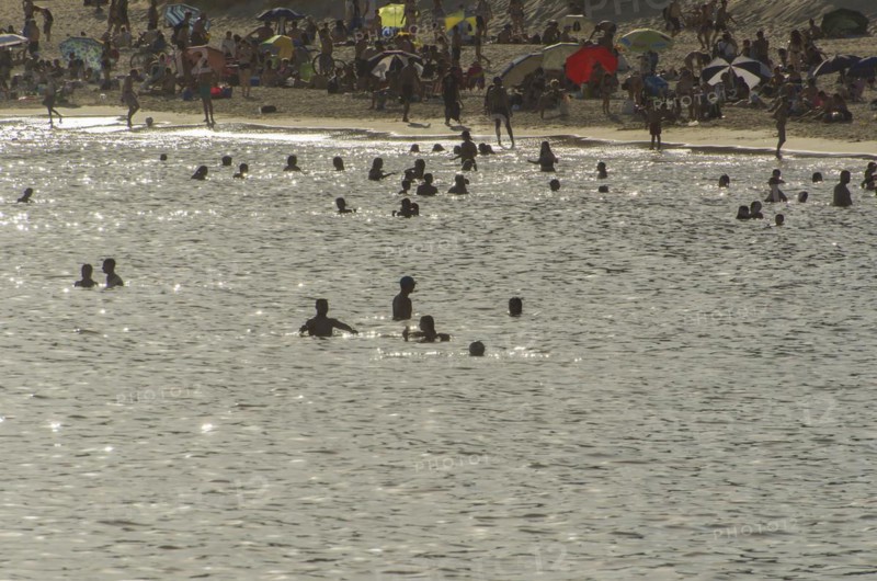 Montevideo, Uruguay, 11th January 2022, Beautiful sunset on Pocitos beach with bathers on a summer day in Montevideo Uruguay, South America