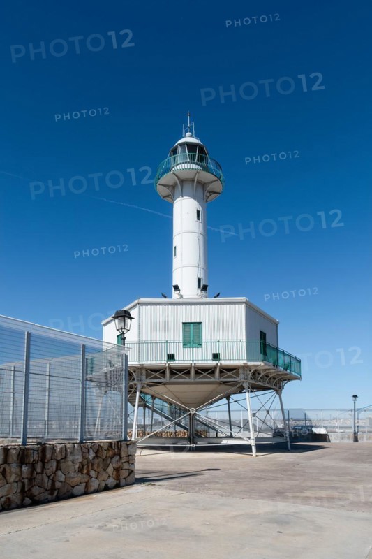 Far de la Banva lighthouse on the Moll de Llevant promenade, a 4.5 km long promenade for joggers, walkers, cyclists and skaters at the harbour of Tarragona, Spain, Europe