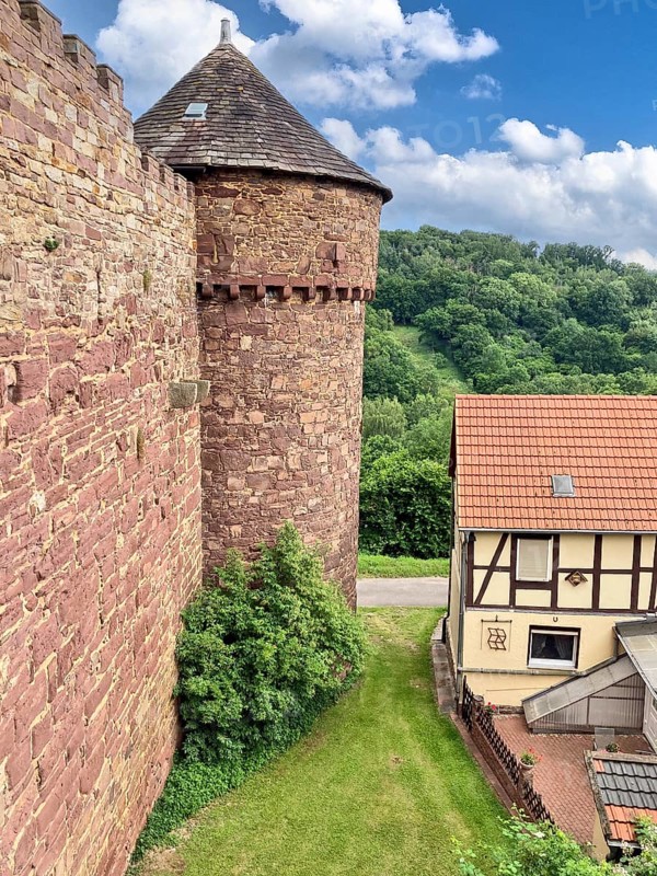 View of corner defence tower with shingles covered watchtower defence tower of medieval Trendelburg from the Middle Ages 13th century castle in fairy tale fairy tale castle of Rapunzel today castle hotel Trendelburg, Trendelburg, Weserbergland, Hesse, Germany, Europe