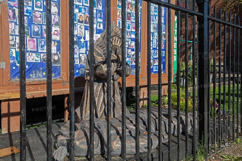 Chicago, Illinois, A bronze sculpture called Thou Shalt Not Kill shows Jesus Christ weeping over a victim of gun violence. The work, outside St. Sabina Catholic Church, is by Canadian artist Timothy Schmalz. It stands in front of a memorial wall of photos of young people who have lost their lives due to gun violence