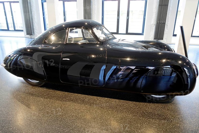 1939 PORSCHE TYPE 64 VW TYPE 60, side view of an elegant black Porsche sports car in an exhibition hall, AUTOMUSEUM PROTOTYP, Hamburg, Hanseatic City of Hamburg, Germany Europe