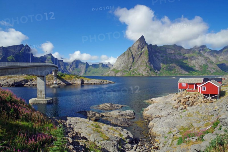 High mountains by a fjord, rorbuer on rocky islands, Hamnoey, Nordland, Norway, Europe
