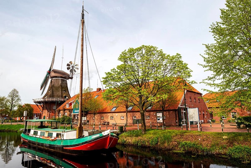 Historic windmill, gallery hollaender, traditional ship Mariechen, on the Grossefehn Canal, Westgrossefehn, municipality of Grossefehn, district of Aurich, East Frisia, Lower Saxony, Germany, Europe