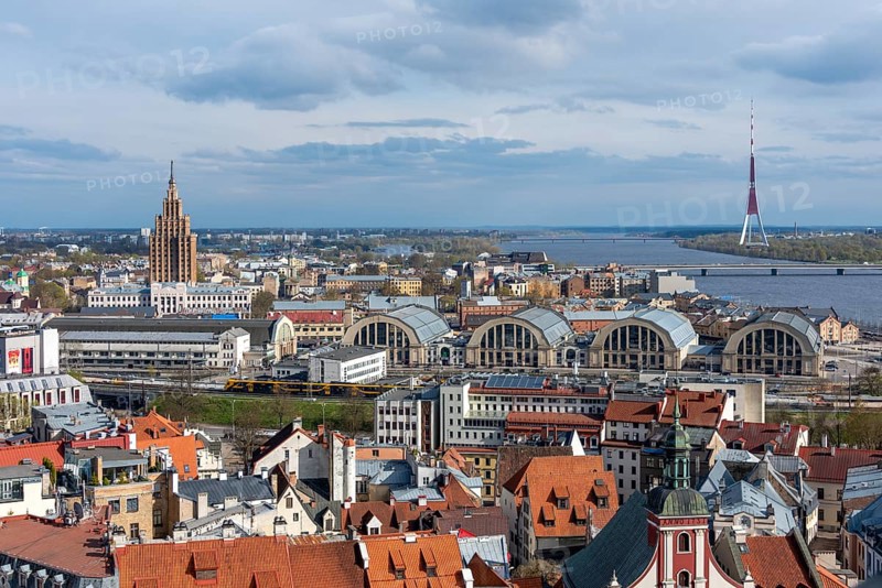 View of the Moscow suburb with the Academy of Sciences (l) and the central market (r), behind it on the western bank of the Daugava is the television tower of the Latvian capital Riga, Latvia, Europe