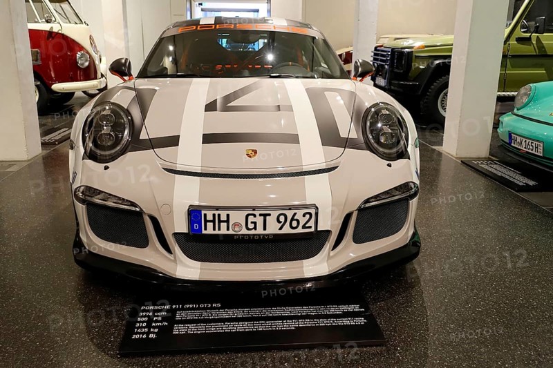 White Porsche 911 GT3 RS, Porsche sports car with distinctive GT stripes in an automobile exhibition, AUTOMUSEUM PROTOTYP, Hamburg, Hanseatic City of Hamburg, Germany Europe