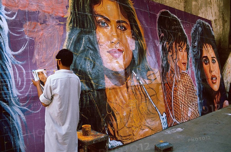 Christian man painting cinema posters, Pakistan, Asia