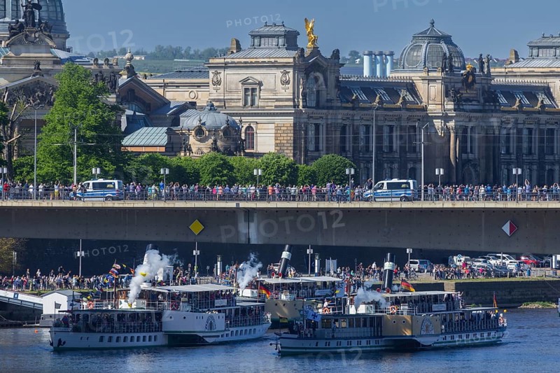 Every year on 1 May, the historic passenger steamers (PD) and the two saloon ships of the White Fleet form a decorated parade with live music on the ships. The banks and bridges of the Elbe are lined with thousands of spectators, Dresden, Saxony, Germany, Europe