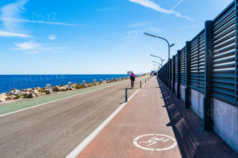 Moll de Llevant waterfront promenade, a 4.5 km long promenade for joggers, walkers, cyclists and skaters at the harbour of Tarragona, Spain, Europe