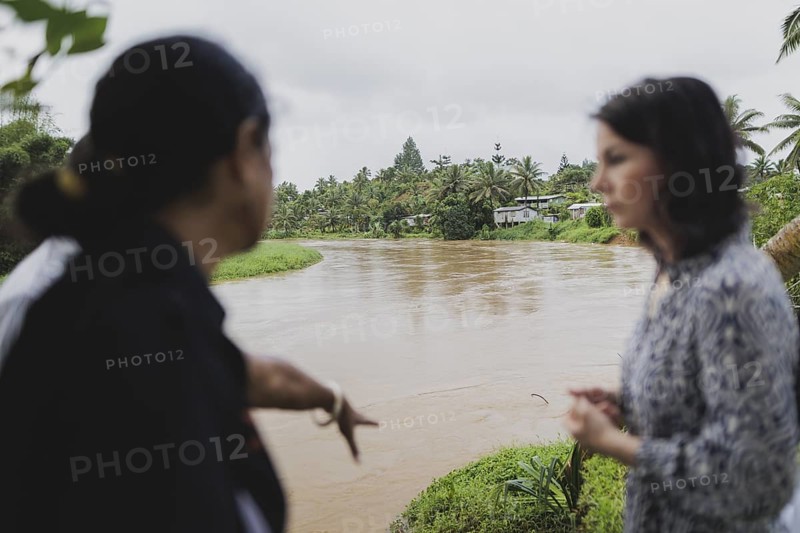 (R-L) Christine Fung, employee of the Deutsche Gesellschaft fuer Internationale Zusammenarbeit, and Annalena Baerbock (Buendnis 90/Die Gruenen), Federal Foreign Minister, photographed during a visit to the village of Vuniniudrovo, 6 May 2024. Baerbock is travelling to Australia, New Zealand and Fiji for political talks / Photographed on behalf of the Federal Foreign Office