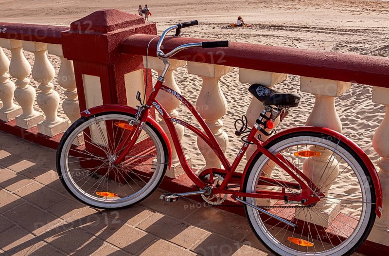 Red ladies' bicycle, balustrade on the beach of Bornos, Andalusia, Spain, Europe