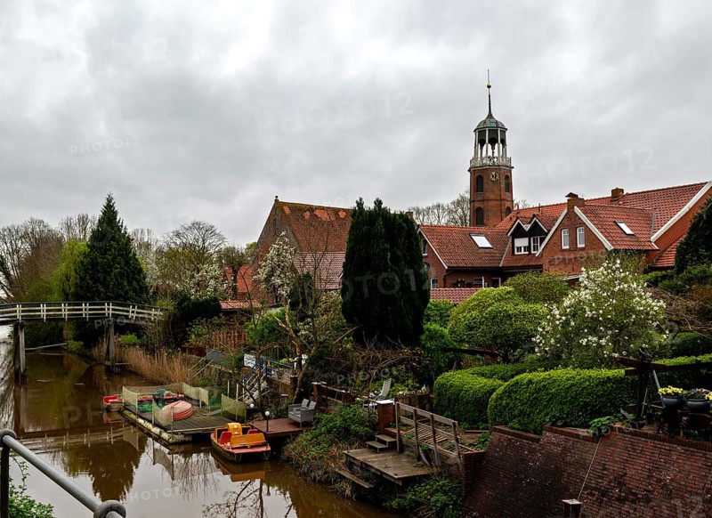 Luettje Bruegg across the Ditzum-Bunder Sieltief in the fishing village of Ditzum, behind the bell tower of the Protestant Reformed Church, municipality of Jemgum, district of Leer, Rheiderland, East Frisia, Lower Saxony, Germany, Europe