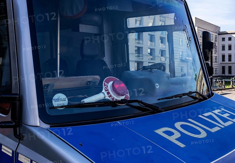 Parked police vehicle with red stop stick behind the windscreen, Berlin, Germany, Europe