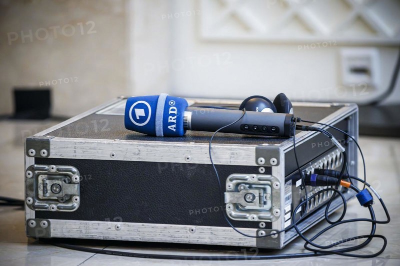 A microphone of the ARD broadcasting network is placed on a split box. Berlin, 26.04.2024