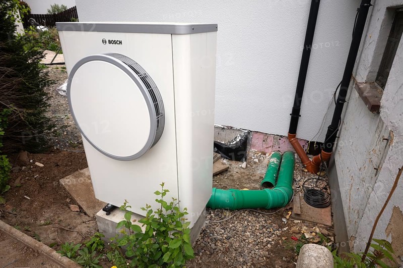 Bosch Compress 7400i AW air-to-water heat pump, logo, outdoor unit, heating hose, pipe, construction site, new build, building services, Stuttgart, Baden-Wuerttemberg, Germany, Europe