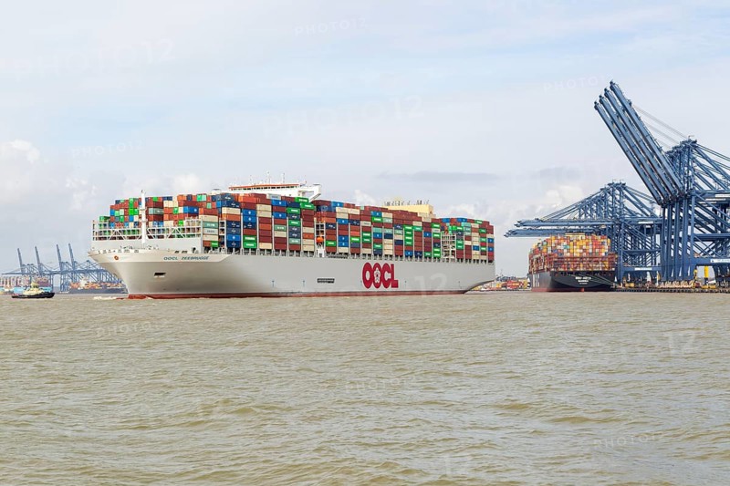 OOCL Zeebrugge container ship leaving quayside departing from Port of Felixstowe, Suffolk, England, UK
