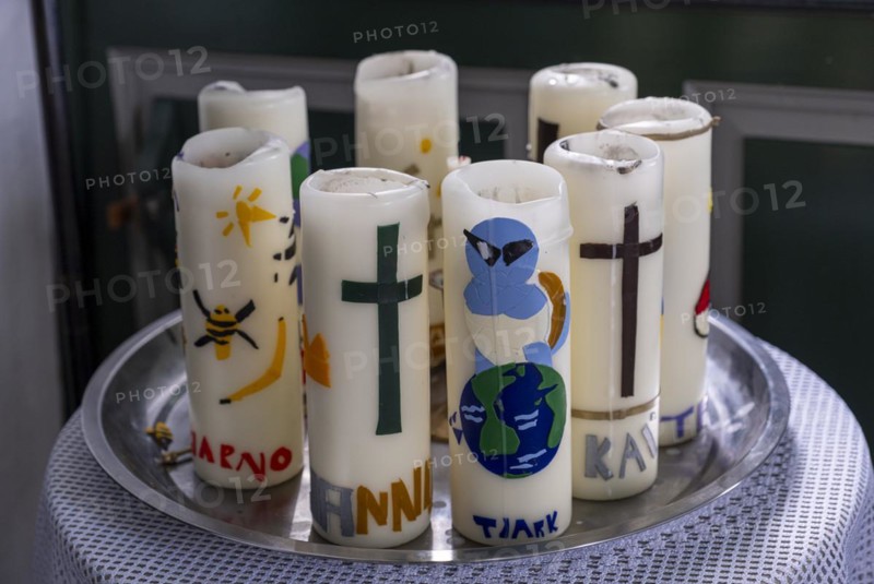 Confirmation candles, decorated candles with the names of the confirmands of 2024 in the Protestant Reformed Church of 1401 in Greetsiel, Krummhoern, East Frisia, Lower Saxony, Germany, Europe