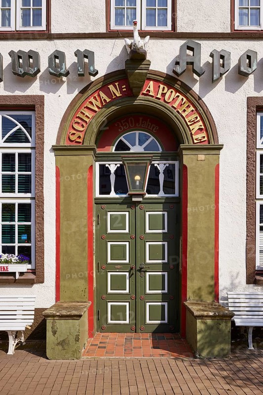 Entrance door of the Swan pharmacy in the city centre of Husum, district of Nordfriesland, Schleswig-Holstein, Germany, Europe