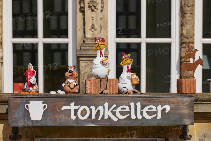 Small figures and the Bremen Town Musicians in front of the entrance to the tonkeller gift shop on the market square in Bremen, Hanseatic city, state of Bremen, Germany, Europe