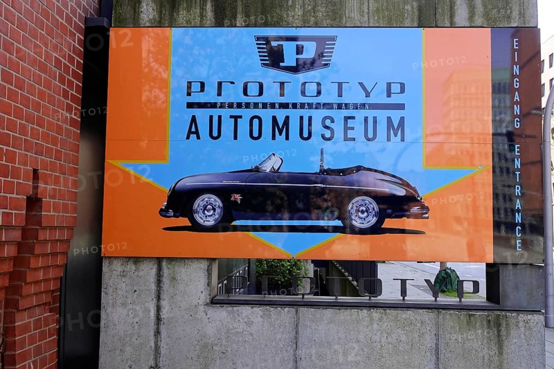 An advertising banner for the prototype car museum with an image of a classic car against an orange background, AUTOMUSEUM PROTOTYP, Hamburg, Hanseatic City of Hamburg, Germany Europe