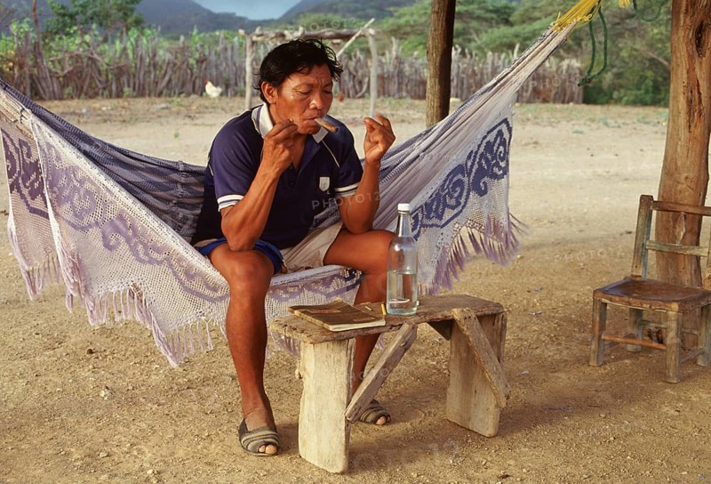 Wayuu tribe, shaman, medicine man, healing session, smoking cigar, drinking alcohol, La Guajira, Colombia, South America