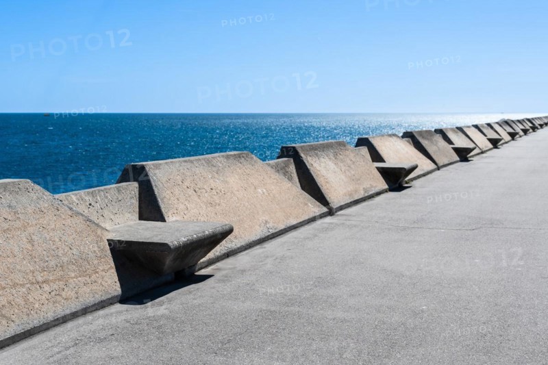 Concrete benches on the Moll de Llevant waterfront promenade, a 4.5 km long promenade for joggers, walkers, cyclists and skaters at the harbour of Tarragona, Spain, Europe