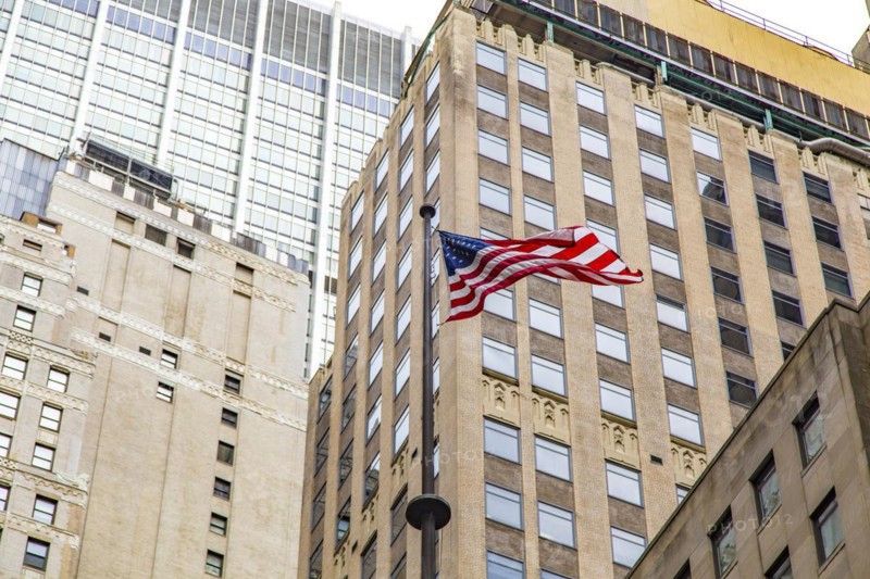US flag in front of the New York Stock Exchange, Manhattan, New York City