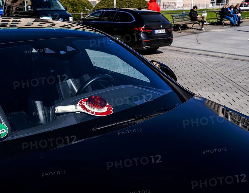 Parked police vehicle with red stop stick behind the windscreen, Berlin, Germany, Europe