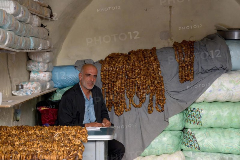 Man selling dried figs, Mardin bazaar, Turkey, Asia