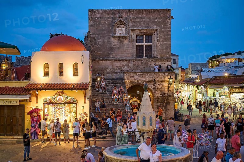St Paul's Gate, Hippocrates Square, Lively square at night with a fountain and surrounding shops, Night shot, Rhodes Old Town, Rhodes, Dodecanese, Greek Islands, Greece, Europe